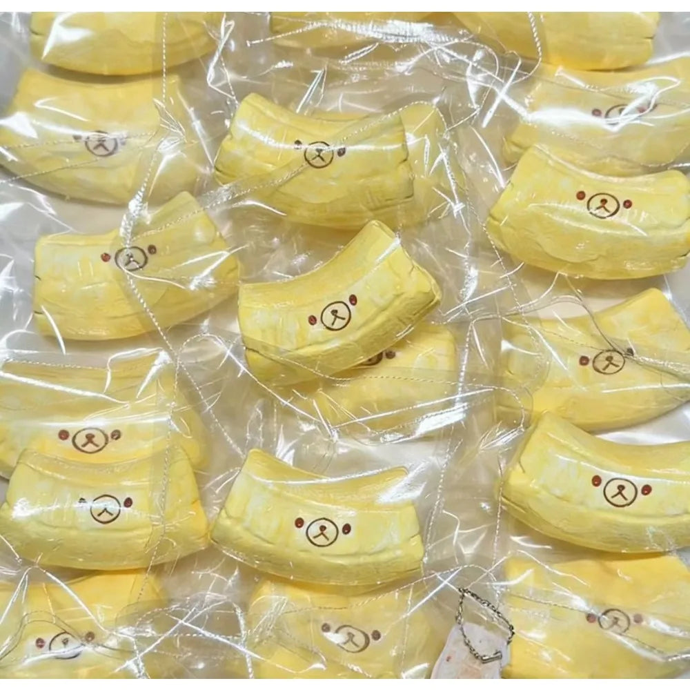 Yellow banana bear squishy stress relief toy made of butter-textured silicone