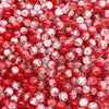 Close-up view of small, round, red glass crackle beads for jewelry making.