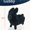 A black soft plush rabbit stuffed toy with large eyes and ears.