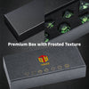 A premium black box with a frosted texture containing seven green polyhedral dice.