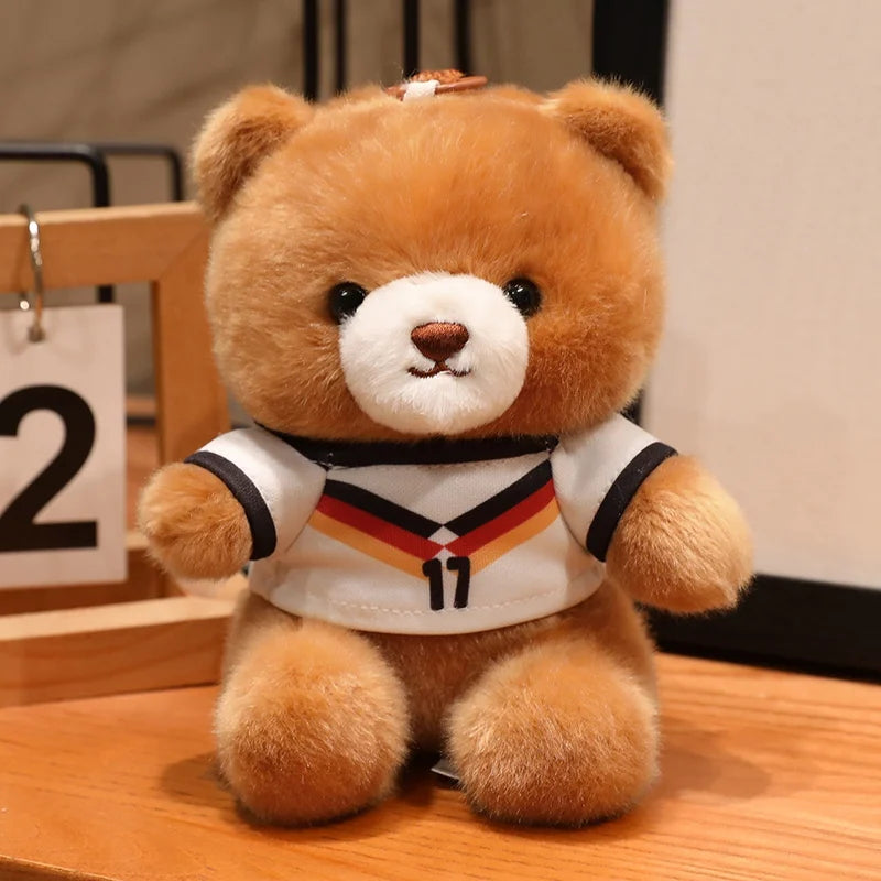 A fluffy brown teddy bear wearing a white and black football jersey with the number 11.
