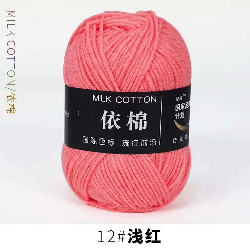 A ball of bright pink milk cotton yarn labeled 12# light pink thread for knitting and crochet.