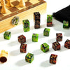 A collection of ten dual-color +1/-1 counting dice arranged on a white surface next to a wooden chessboard.