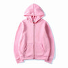 A pink oversized zip-up hoodie with a hood and front pocket shown against a white background.