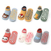 A pack of six kids cotton cartoon animal socks with non-slip grips in various colors and designs.