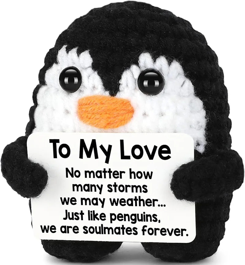 Black and white penguin plush toy with a sign that reads To My Love