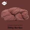 A ball of reddish-pink merino wool yarn labeled as Lirisnly's hand-picked 300g Merino.