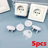 Five white rotating socket safety covers for baby proofing displayed on a light blue surface.