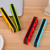 A collection of colorful wooden harmonica products featuring cartoon animal designs on a light wooden surface.