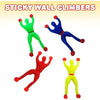 A set of four colorful sticky wall climbers in green, blue, red, and yellow for children's play.