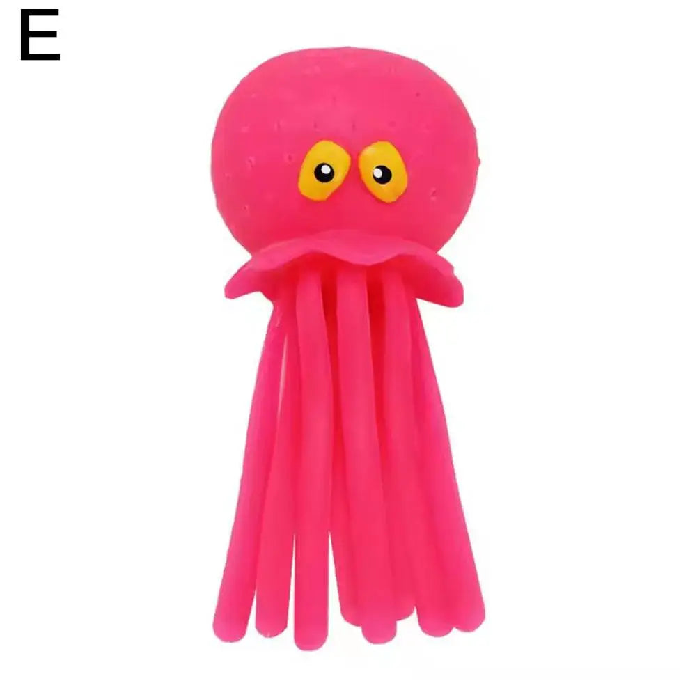 A bright pink squeeze and soak octopus bath toy for toddlers.