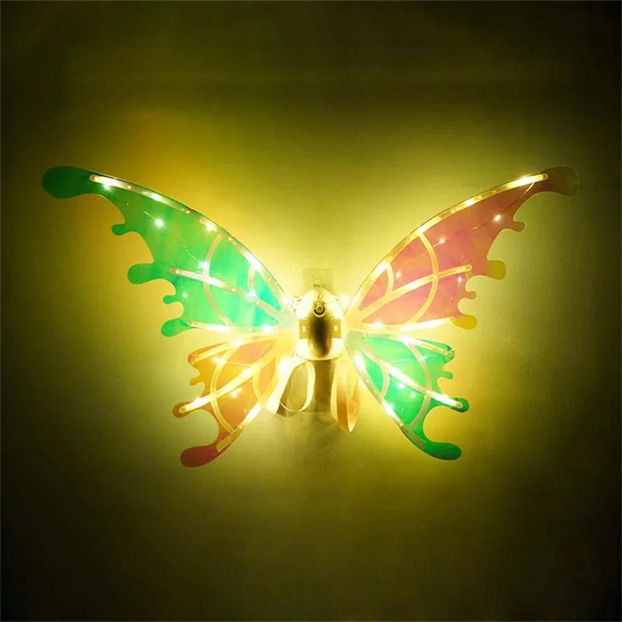 A glowing fairy wings dress-up set featuring green and pink translucent wings.