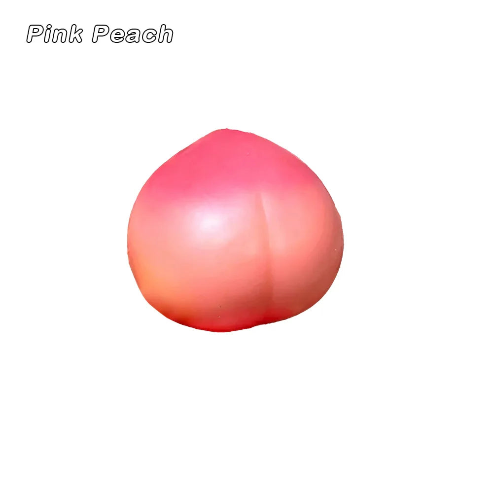 A pink peach-colored squishy stress ball with a smooth, rounded surface.