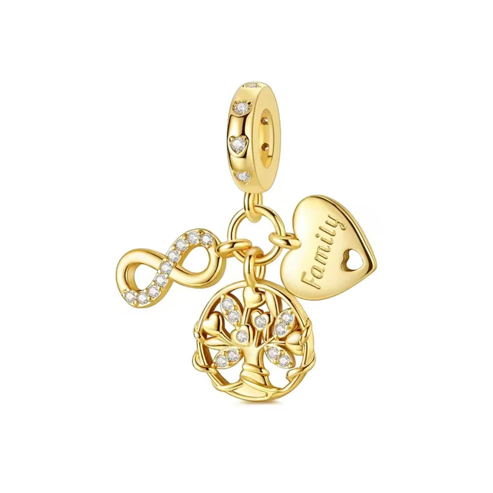 Gold charm bracelet featuring pendants of an elephant, key, butterfly, and heart.