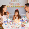 A birthday party setup showing a child and an adult preparing goodie bags with cups, stickers, and pencils.