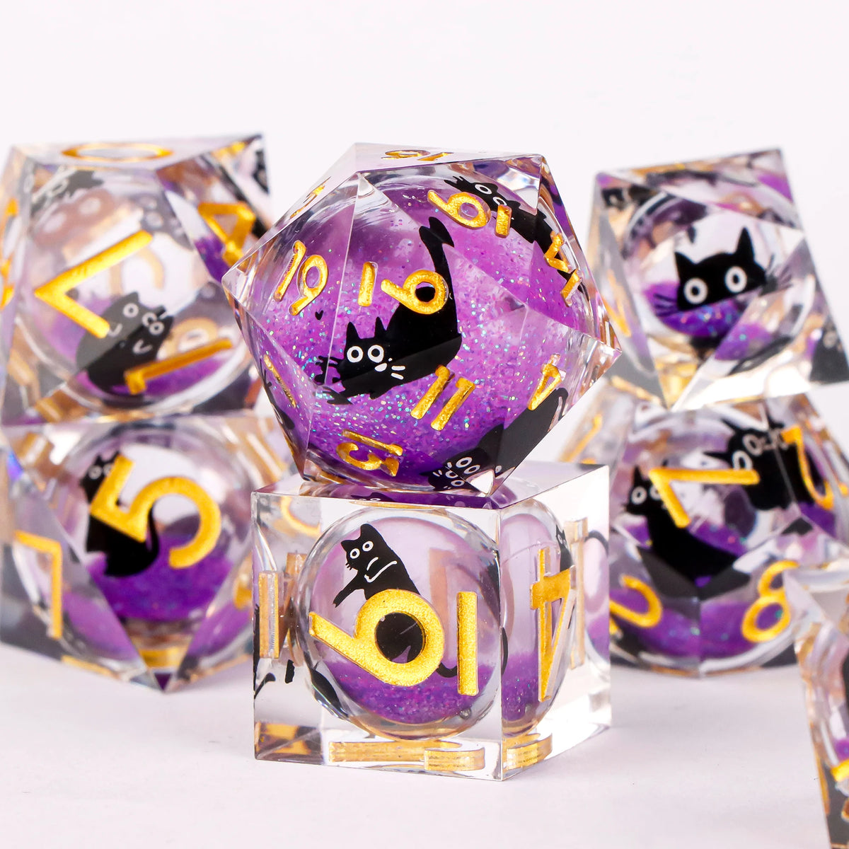 A collection of handmade resin sharp edge dice in various colors and shapes for tabletop role-playing games
