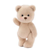 A light beige teddy bear plush toy.