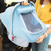 A person is holding a light blue breathable baby car seat cover with a sun shade and mosquito net.