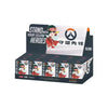 A box set for Overwatch Play of the Game featuring a figurine and game components.