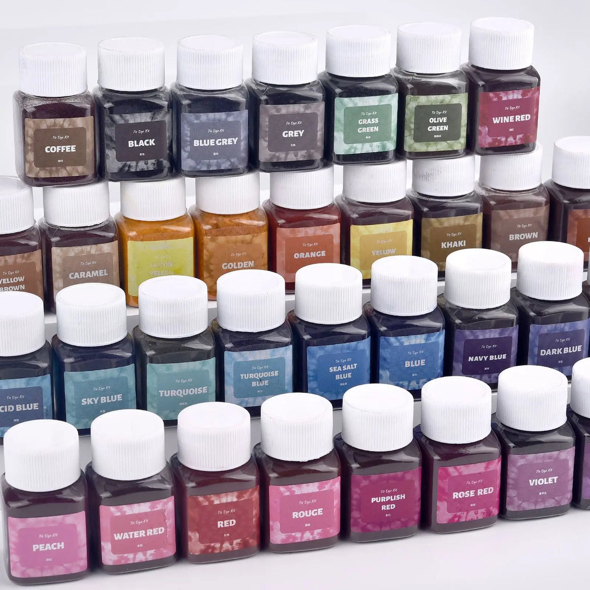 A collection of dark liquid dye powders in various shades including coffee, black, blue, green, and red for textile fabric dy
