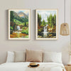 Two framed diamond paintings depicting lush green forests and waterfalls on a neutral wall.
