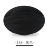 A ball of black chunky chenille yarn for hand knitting