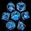 A set of six blue liquid core resin dice shaped like pyramids and dodecahedrons displayed on a reflective surface.