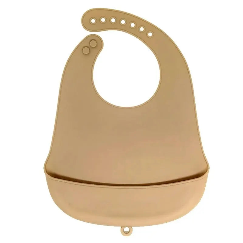 A beige waterproof silicone baby bib with a catch pocket and curved shape.