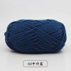 A ball of dark blue pre-dyed milk cotton yarn used for knitting and crochet.