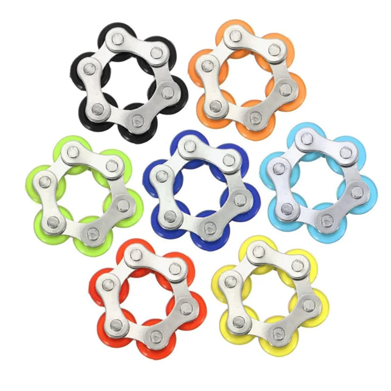 A set of six silver and black flippy bike roller chain fidget toys arranged in a circular pattern.