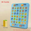 A blue plastic board with 36 compartments holding fruit pieces and chess pieces for a game.