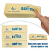 A hand holds a yellow butter stick fidget toy with the label 4oz Butter Net Wt 113 G.