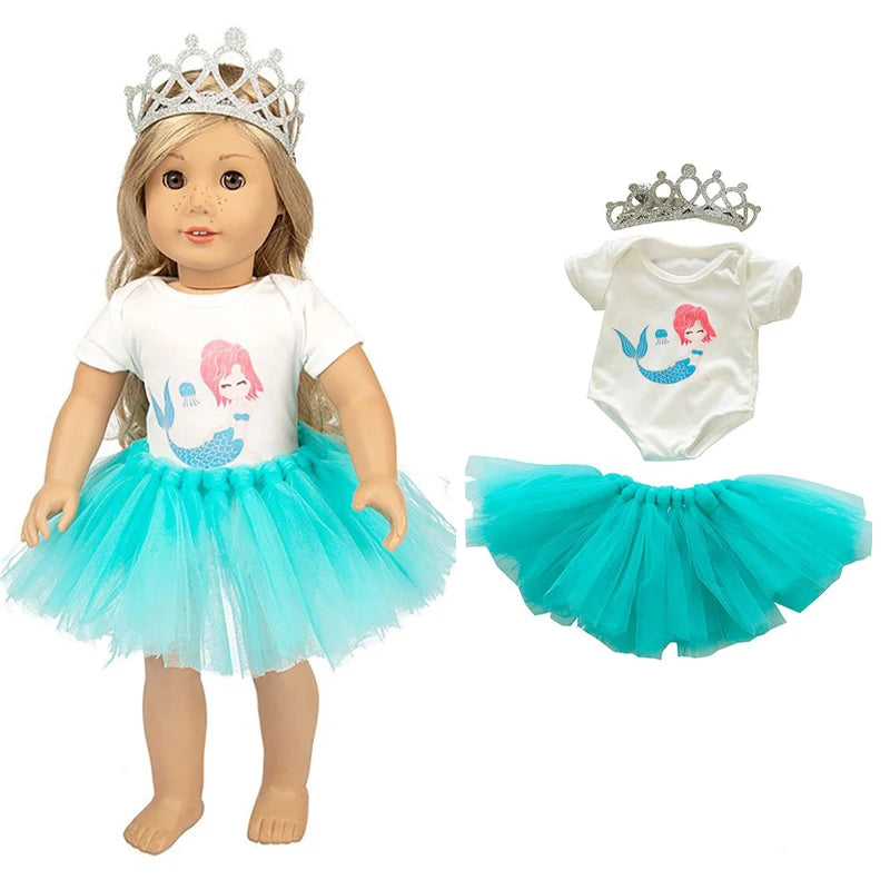 A doll wearing a white top and turquoise tulle skirt with a silver crown and matching accessories.