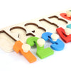 A wooden shape and color sorter puzzle with various colored pieces for toddlers.
