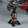 A pair of metal jack stands with 3 ton capacity used for supporting RC crawlers.