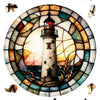 A wooden jigsaw puzzle depicting a coastal lighthouse scene with surrounding elements and a sunset background.