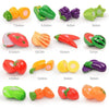 A collection of colorful plastic fruits and vegetables for kids pretend play including tomatoes, peppers, and citrus.