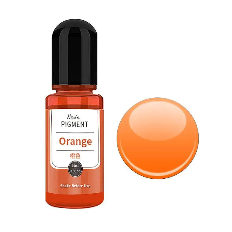 A small amber glass bottle of orange resin pigment next to a round orange pigment disk.