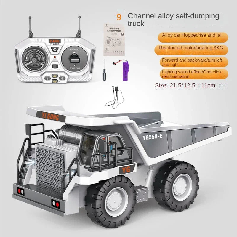 A white and gray channel alloy self-dumping truck toy with a remote control unit and various accessories.