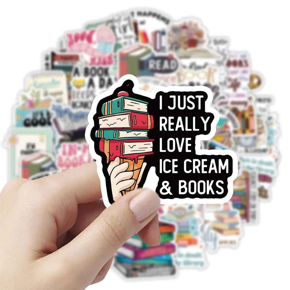 A hand holds a sticker featuring an ice cream cone made of stacked books and the text I just really love ice cream & books