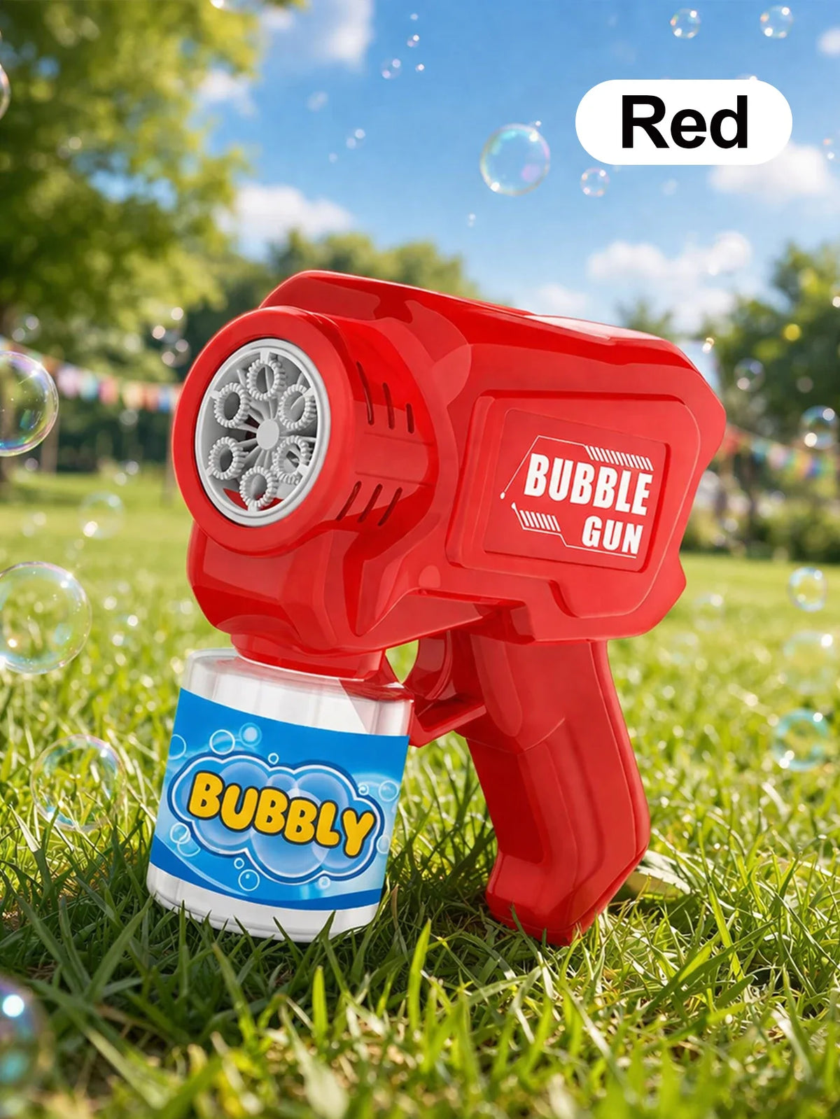 A red bubble gun is shown outdoors on green grass with bubbles in the air.