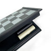 A foldable magnetic checkers board game set with a dark gray and white checkered surface inside a black case.