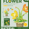 A set of plastic flower blocks in various shapes and colors used for building a model.