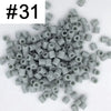 A pile of 1000 assorted 5mm fuse beads in various colors for creative craft projects.