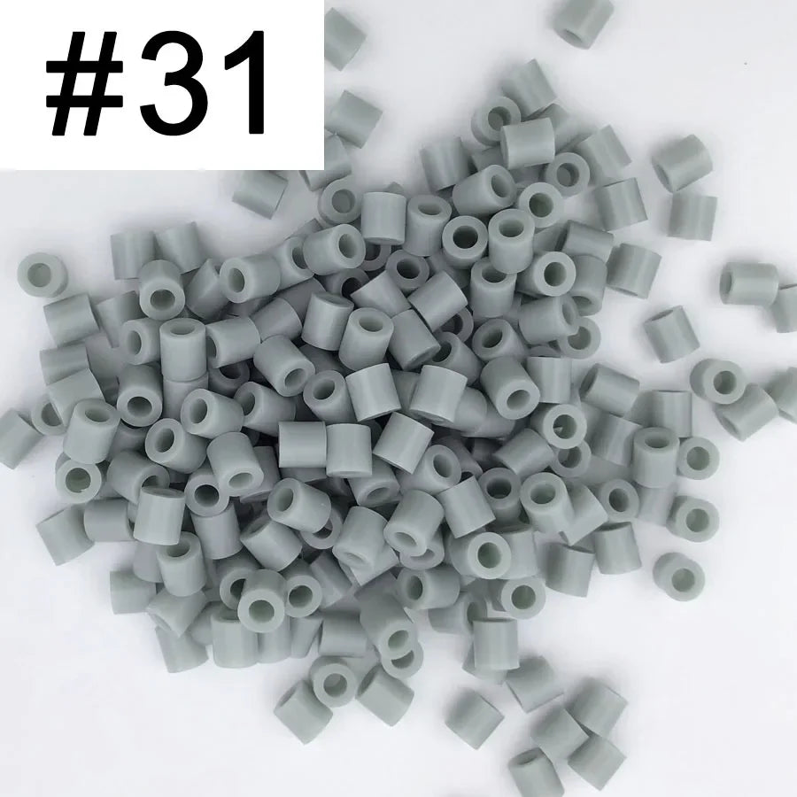 A pile of 1000 assorted 5mm fuse beads in various colors for creative craft projects.