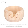 Handcrafted wooden yarn bowl featuring a swirl cutout design.