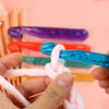 A hand is holding a blue crystal crochet hook, demonstrating the transparent crystal crochet hook set.