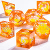 A collection of orange liquid core polyhedral dice showing various numbers and a galaxy finish.
