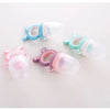 A collection of silicone baby food feeders with teethers in various pastel colors like blue, pink, and purple.