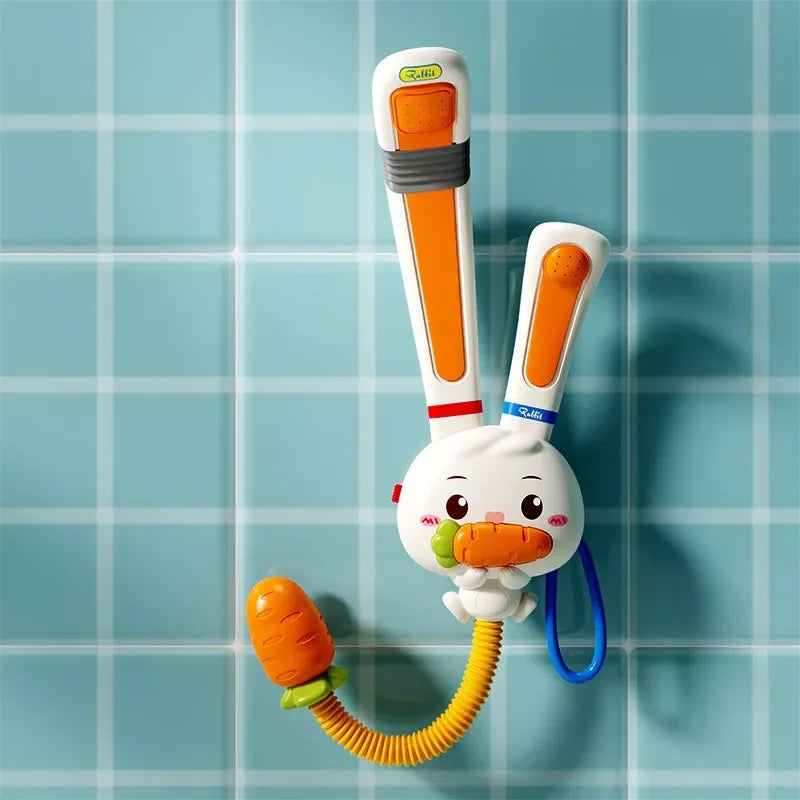 A white rabbit bath toy with an orange carrot attached, featuring an adjustable water sprinkler.